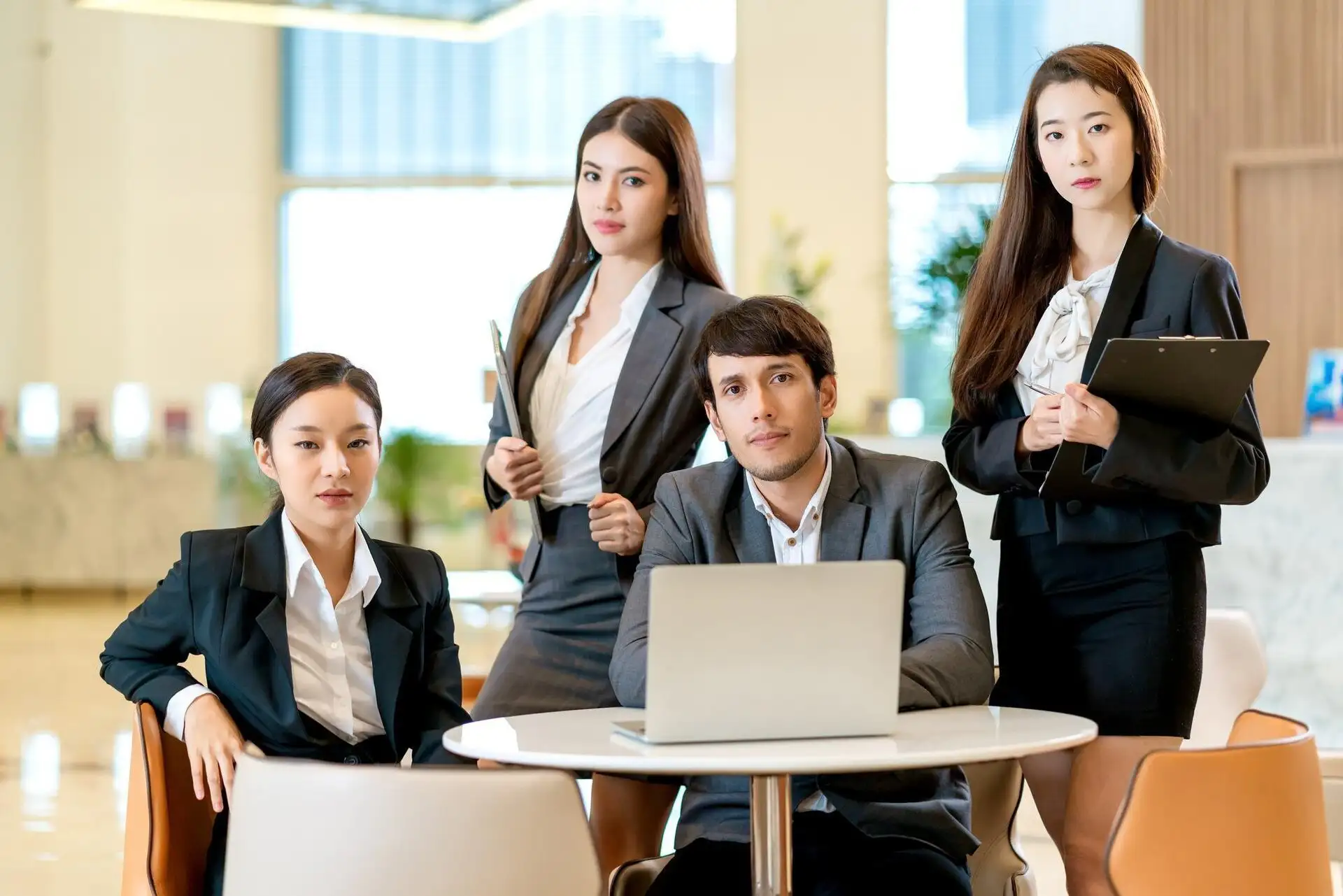 A leadership team reviewing a business plan around a meeting table